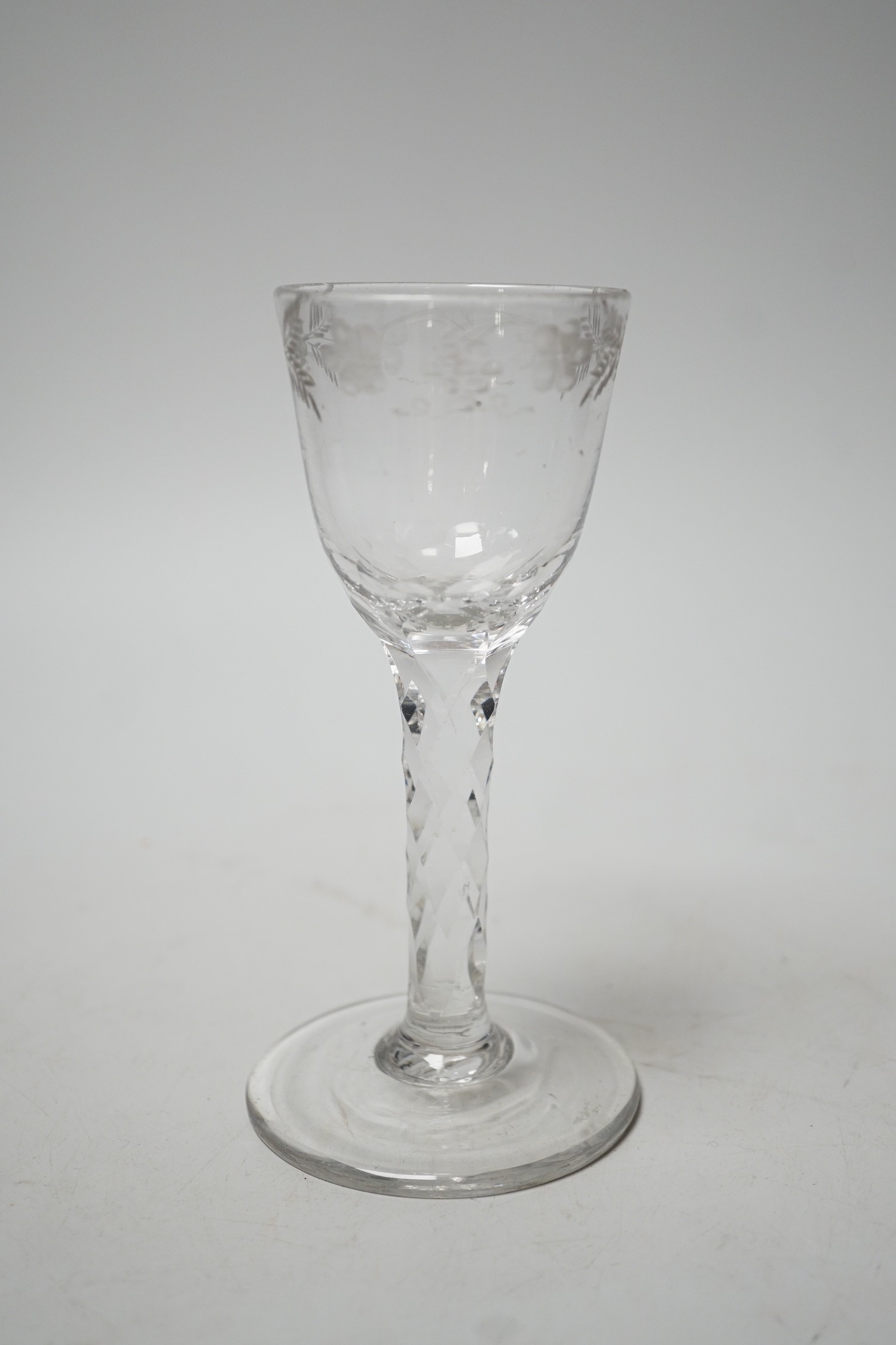 A George III facet stem wine glass. 15.5cm tall